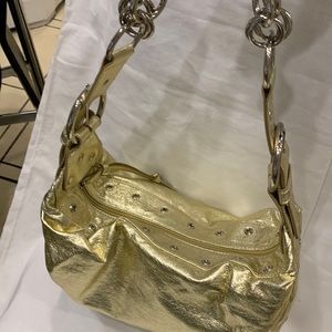 Gold.shiny shoulder bag. 12” X 7” Metallic very roomy with pockets inside